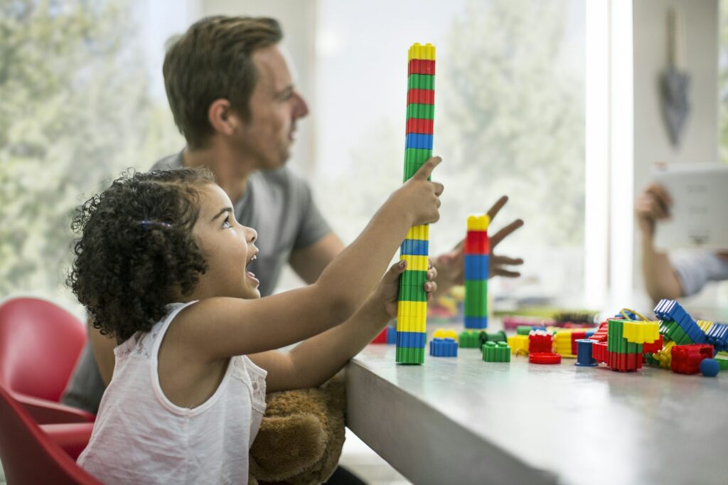 Family playing with building blocks